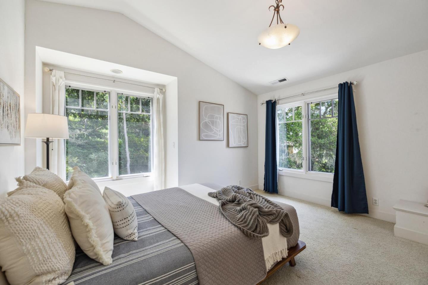 23865 Fairfield Place Carmel, CA 93923 - Photo 42 of 58 a bed sitting in a bedroom next to a window