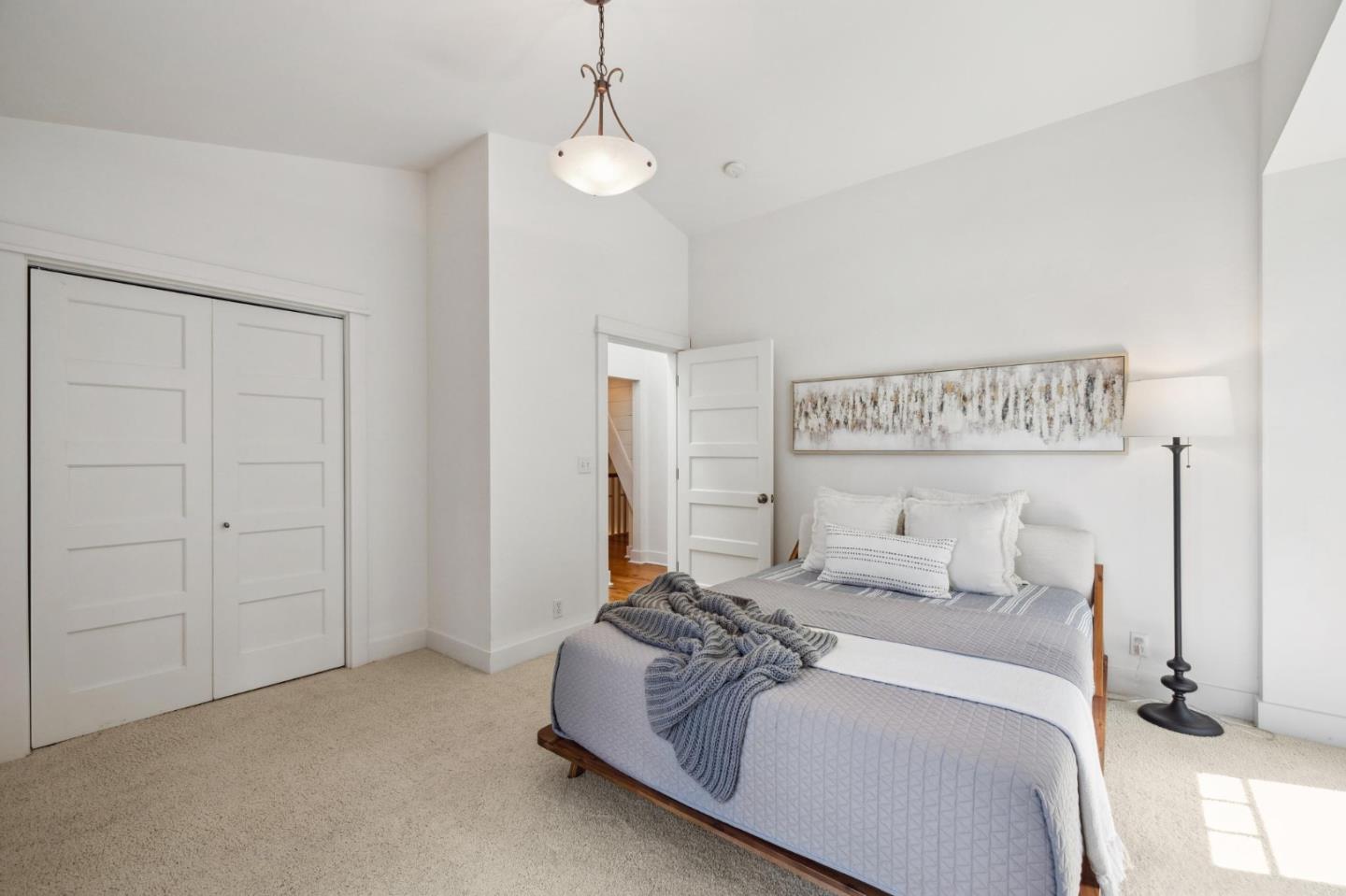 23865 Fairfield Place Carmel, CA 93923 - Photo 44 of 58 a bedroom with a bed and a lamp