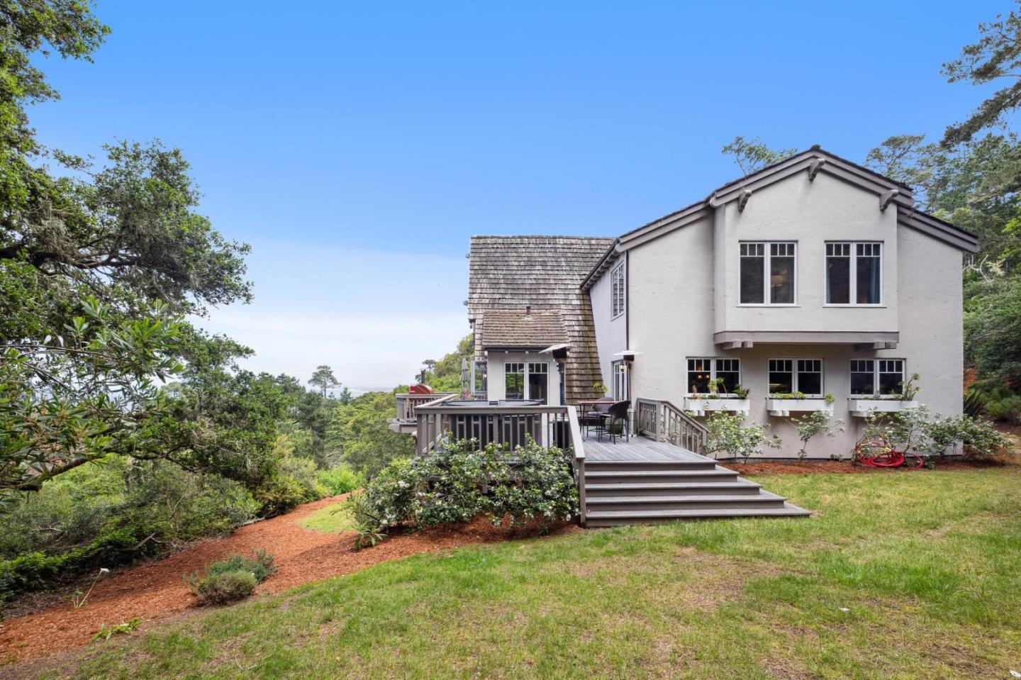 23865 Fairfield Place Carmel, CA 93923 - Photo 50 of 58 a front view of a house with garden
