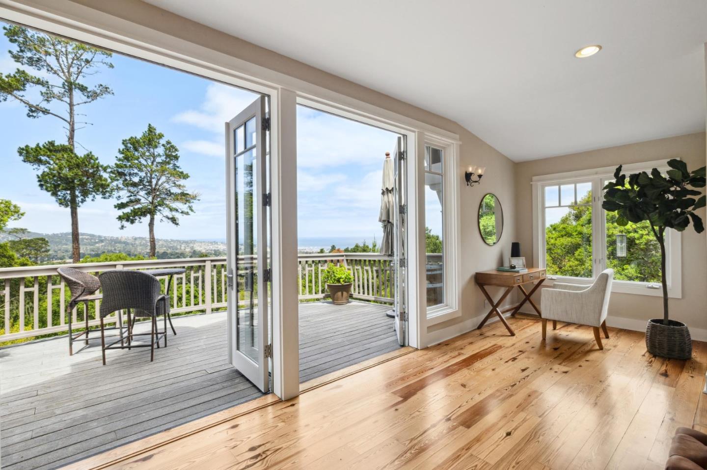 23865 Fairfield Place Carmel, CA 93923 - Photo 6 of 58 a living room with furniture and a potted plant