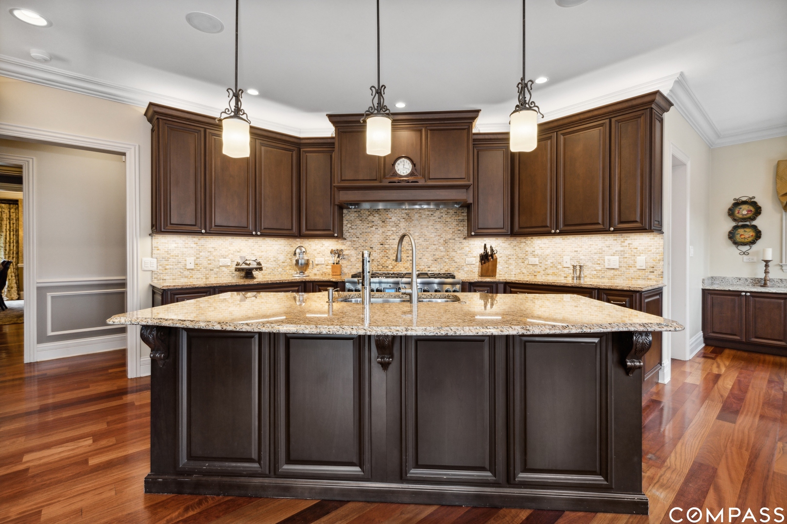 2770 Grace Road Northbrook, IL 60062 - Photo 11 of 51 a kitchen with stainless steel appliances granite countertop a sink a stove and a wooden floor