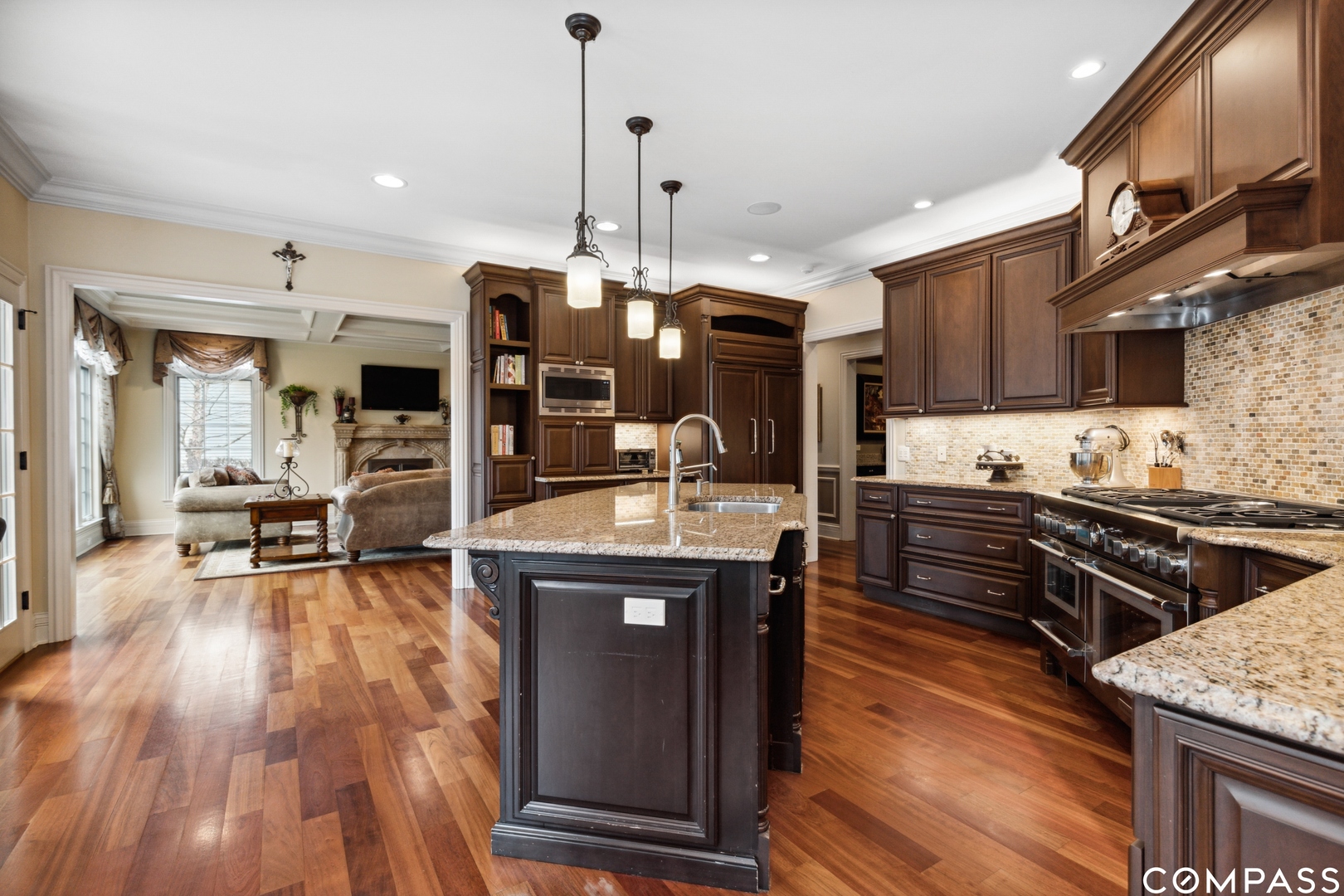 2770 Grace Road Northbrook, IL 60062 - Photo 12 of 51 a kitchen with stainless steel appliances granite countertop a stove and a wooden floors