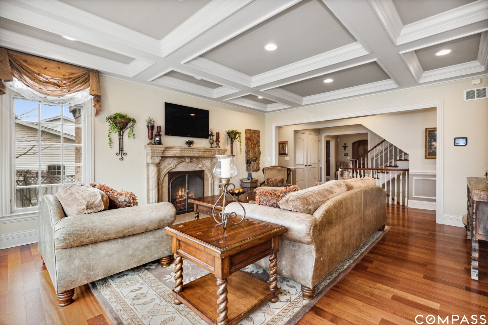 2770 Grace Road Northbrook, IL 60062 - Photo 13 of 51 a living room with furniture a flat screen tv and a fireplace