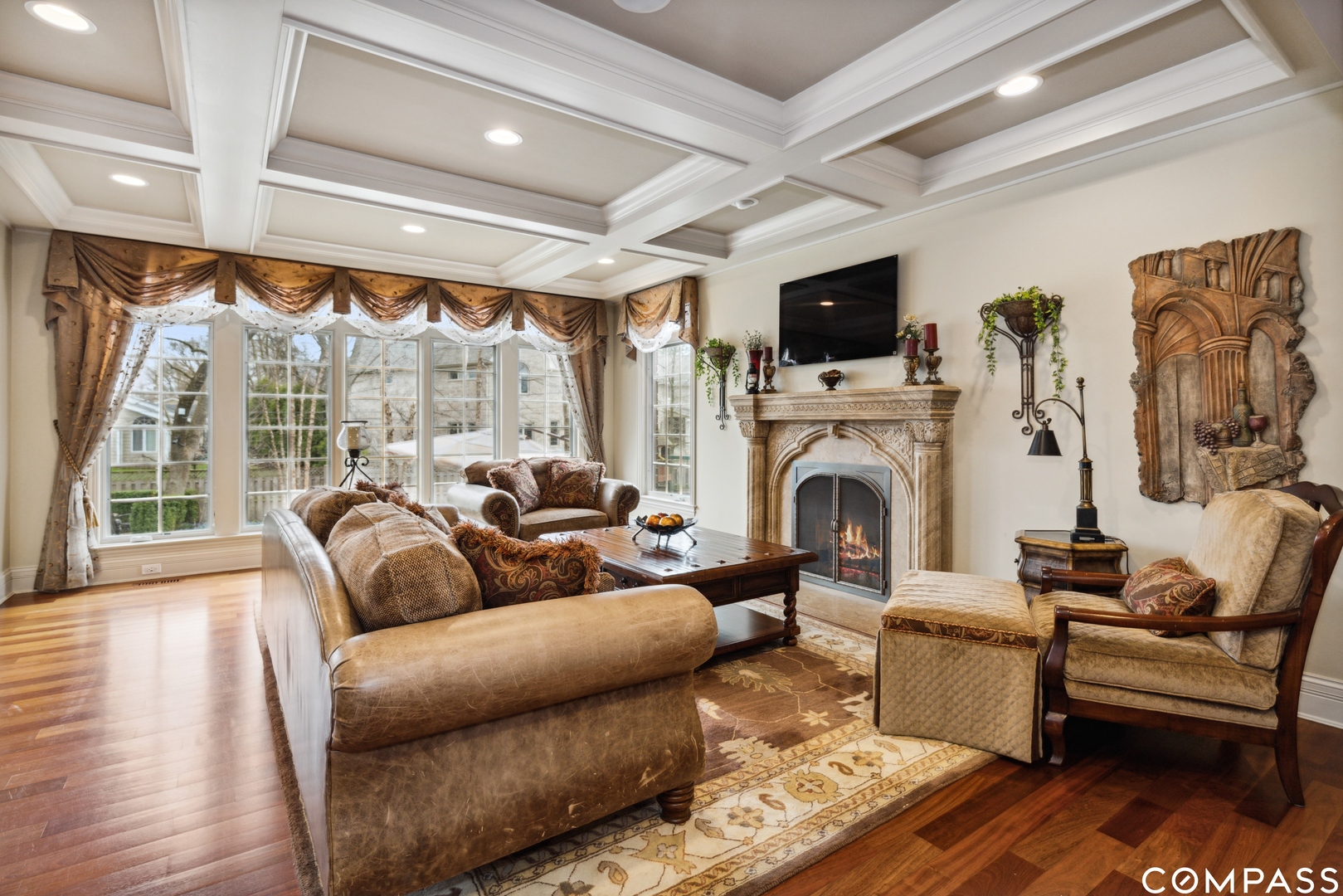 2770 Grace Road Northbrook, IL 60062 - Photo 14 of 51 a living room with furniture a flat screen tv and a fireplace