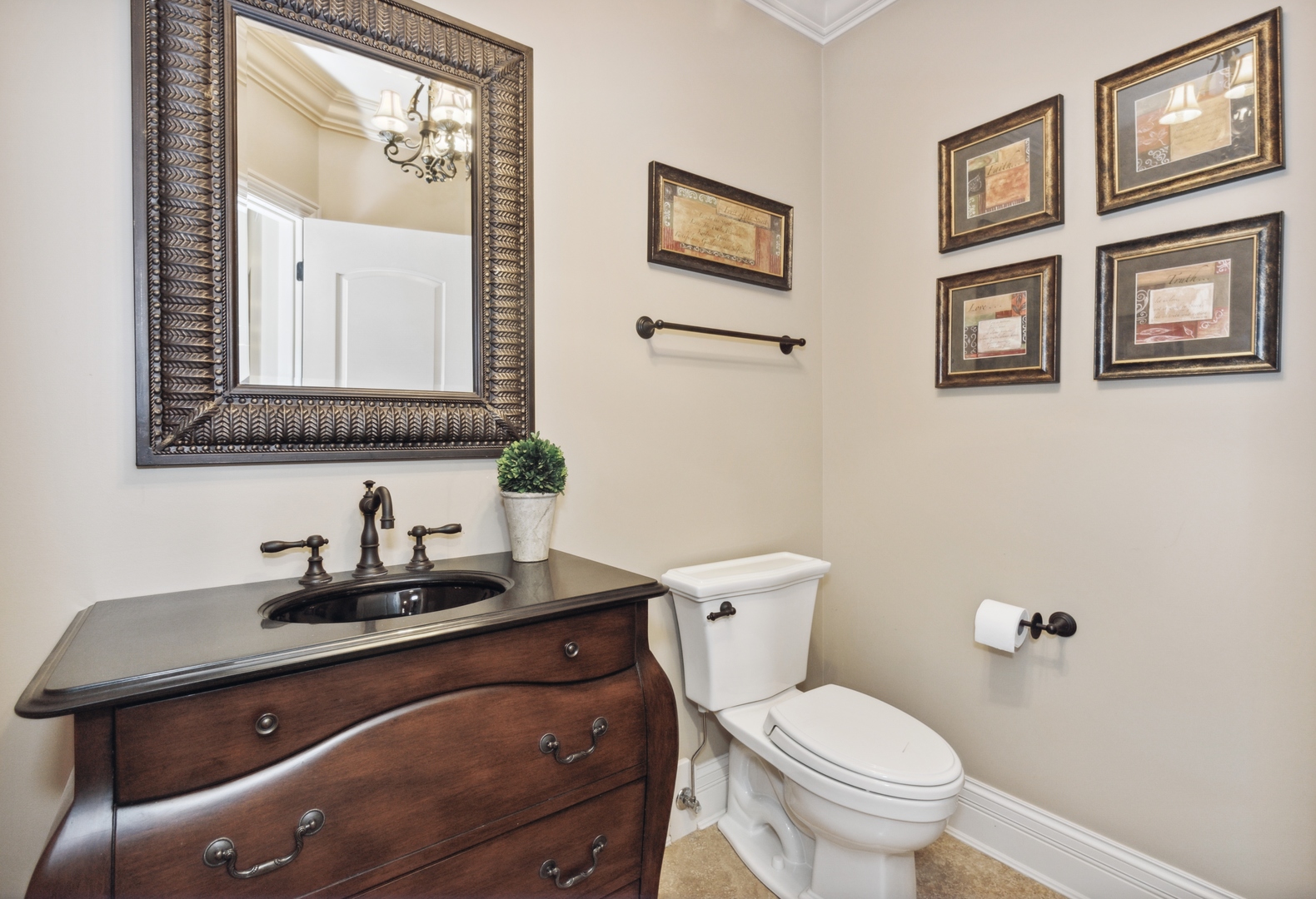 2770 Grace Road Northbrook, IL 60062 - Photo 15 of 51 a bathroom with a granite countertop toilet sink and mirror
