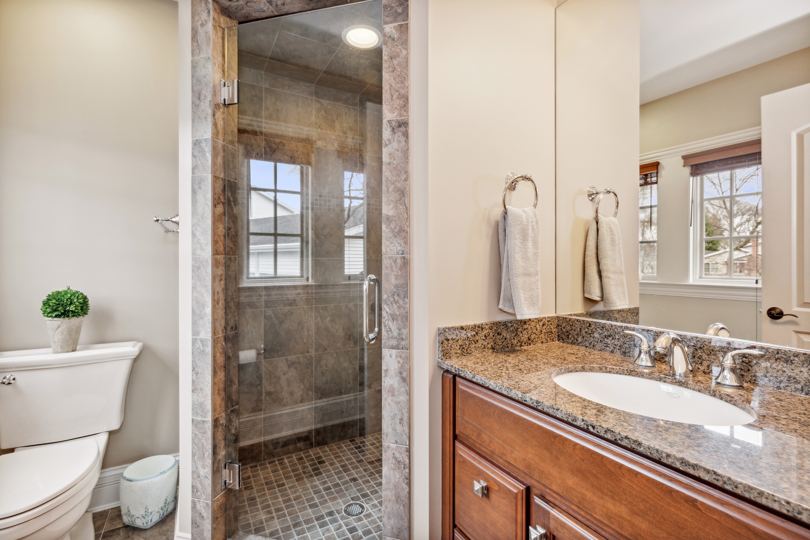 2770 Grace Road Northbrook, IL 60062 - Photo 17 of 51 a bathroom with a granite countertop sink a toilet and shower