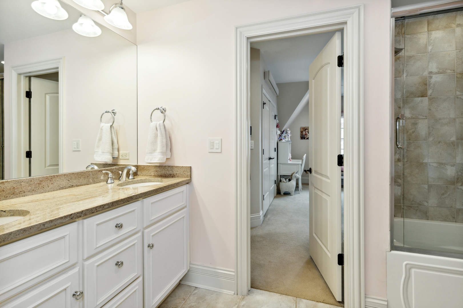 2770 Grace Road Northbrook, IL 60062 - Photo 28 of 51 a en suite bathroom with a granite countertop sink mirror and a