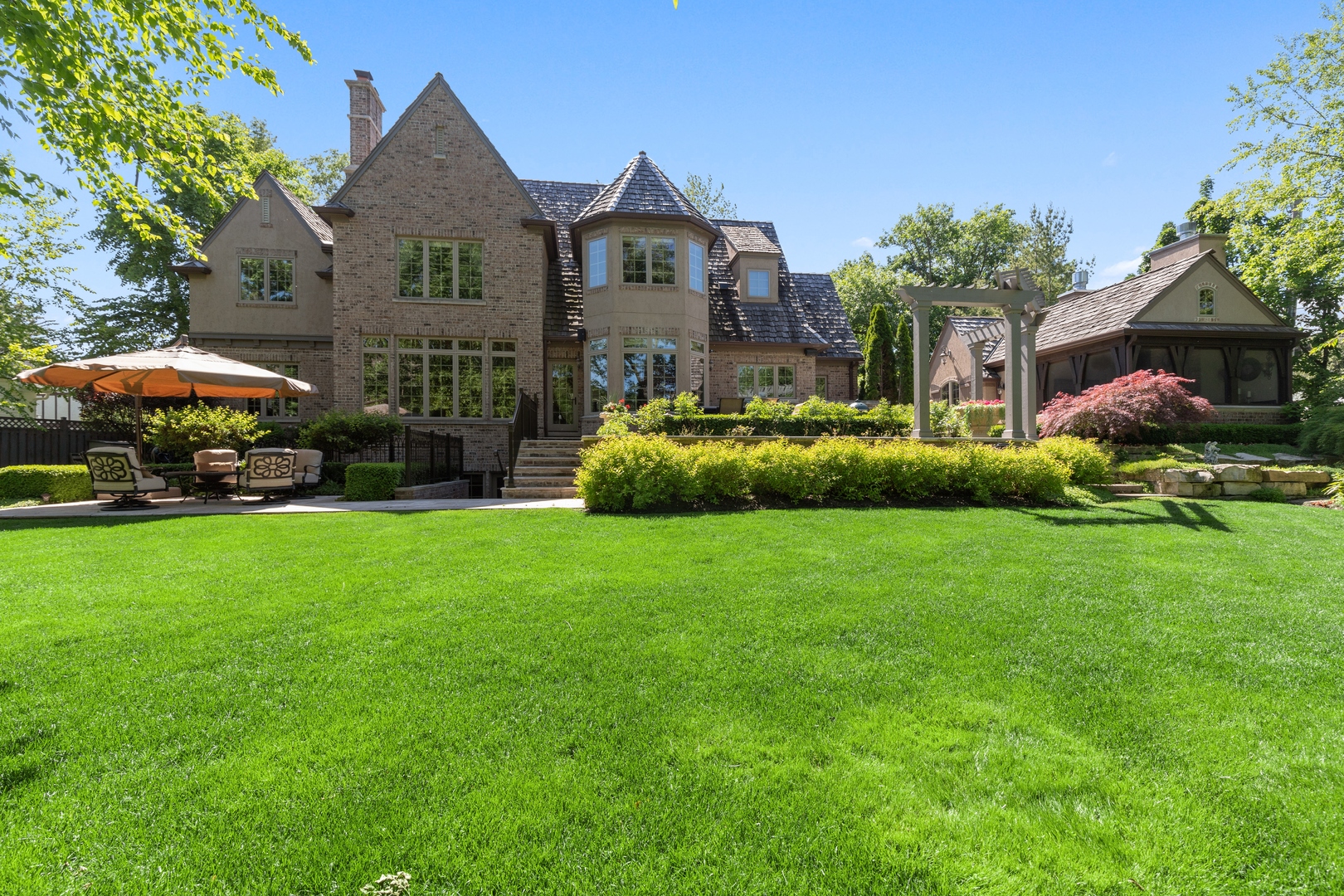 2770 Grace Road Northbrook, IL 60062 - Photo 46 of 51 a front view of a house with a garden