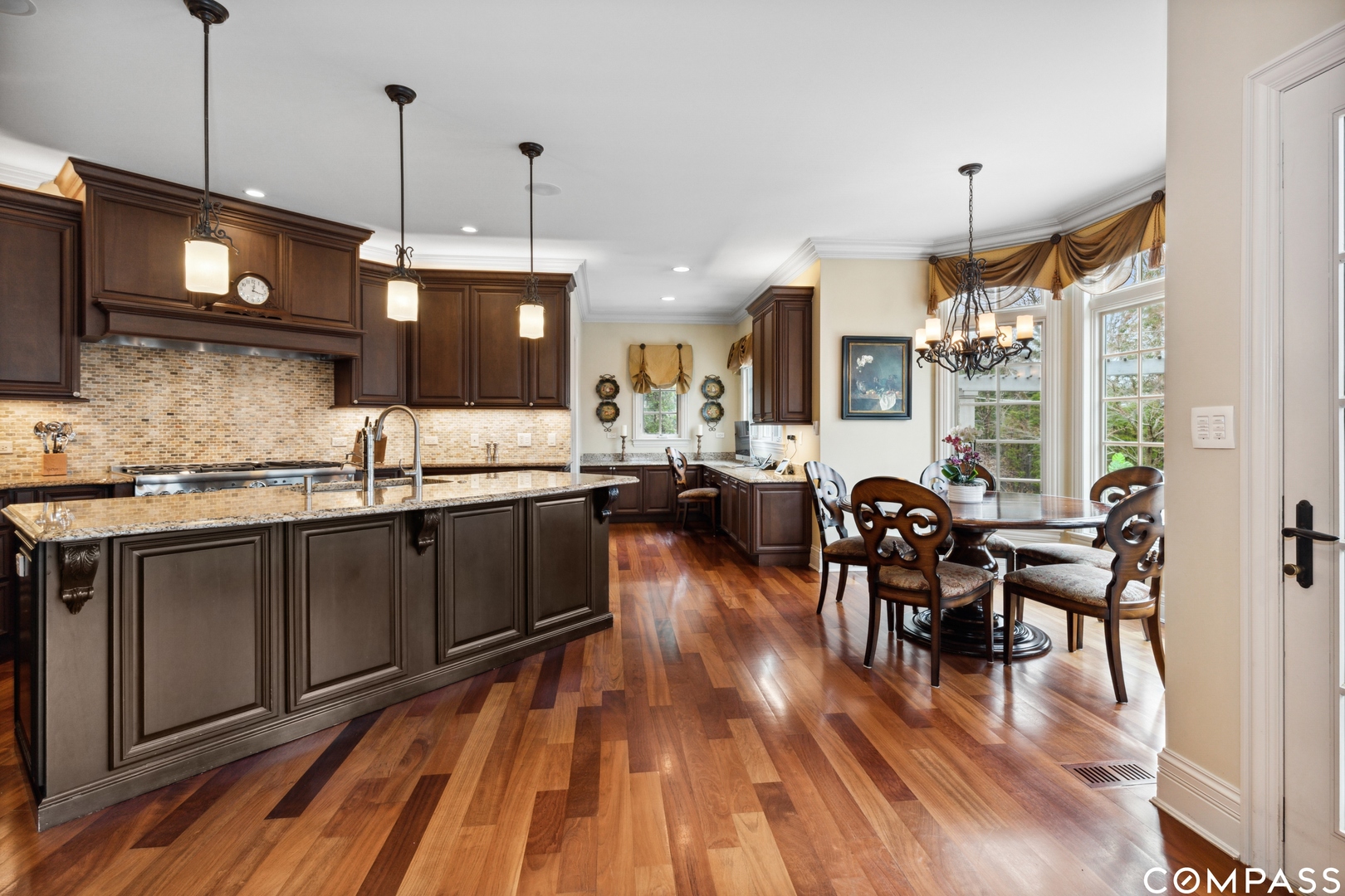 2770 Grace Road Northbrook, IL 60062 - Photo 10 of 51 a open kitchen with stainless steel appliances granite countertop a stove and cabinets with wooden floor