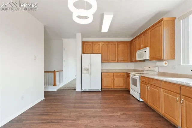 a view of a livingroom with wooden floor