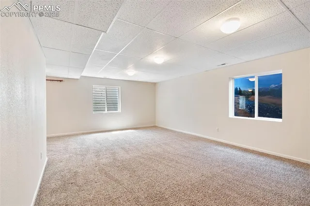 a bathroom with a granite countertop sink toilet and a mirror