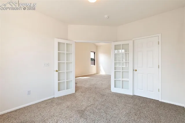 a kitchen with a sink window and cabinets