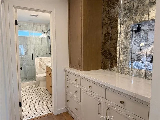 a bathroom with a sink and mirror