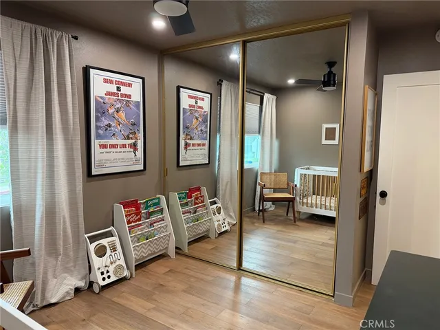 a view of an entryway with furniture and wooden floor