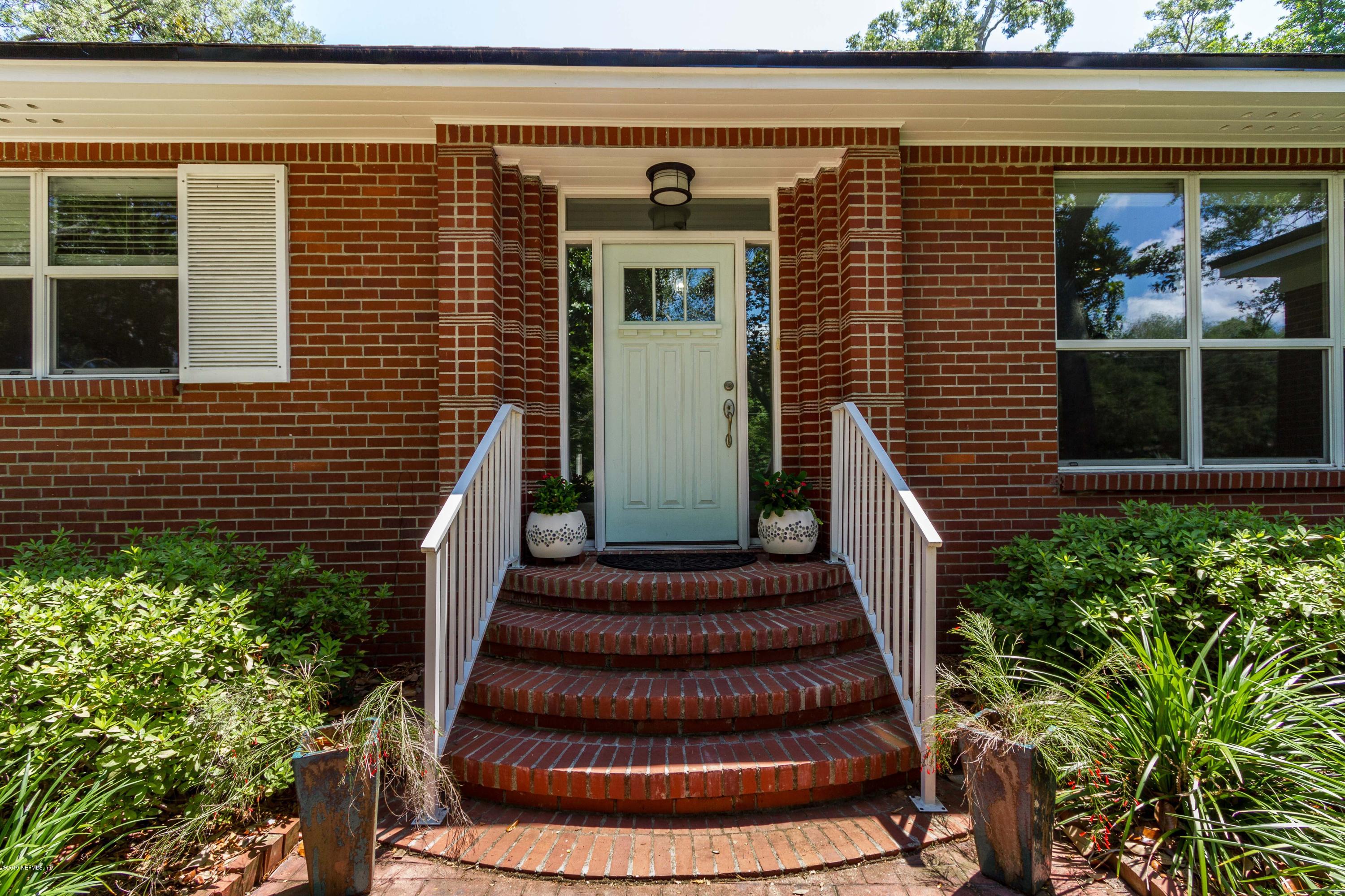 841 Penman Road Neptune Beach, FL 32266 - Photo 2 of 92 a front view of a house with a garden