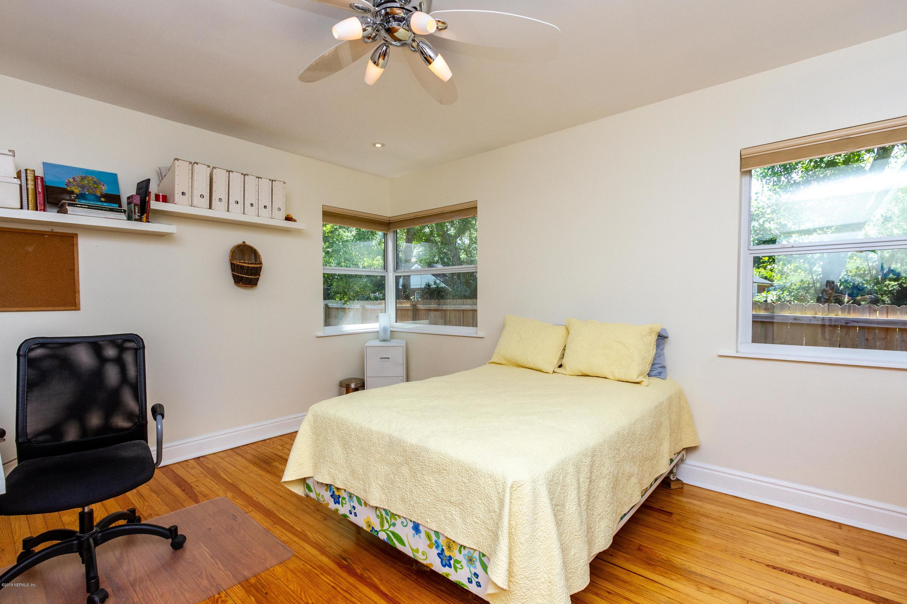 841 Penman Road Neptune Beach, FL 32266 - Photo 25 of 92 a bedroom with a bed and a chair with the wooden floor