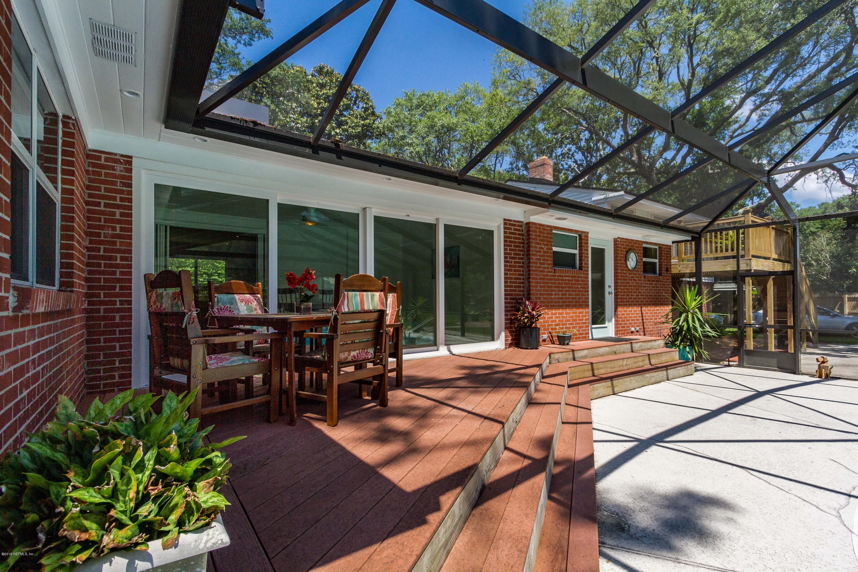 841 Penman Road Neptune Beach, FL 32266 - Photo 34 of 92 a view of a dinning tables and chairs in backyard of the house