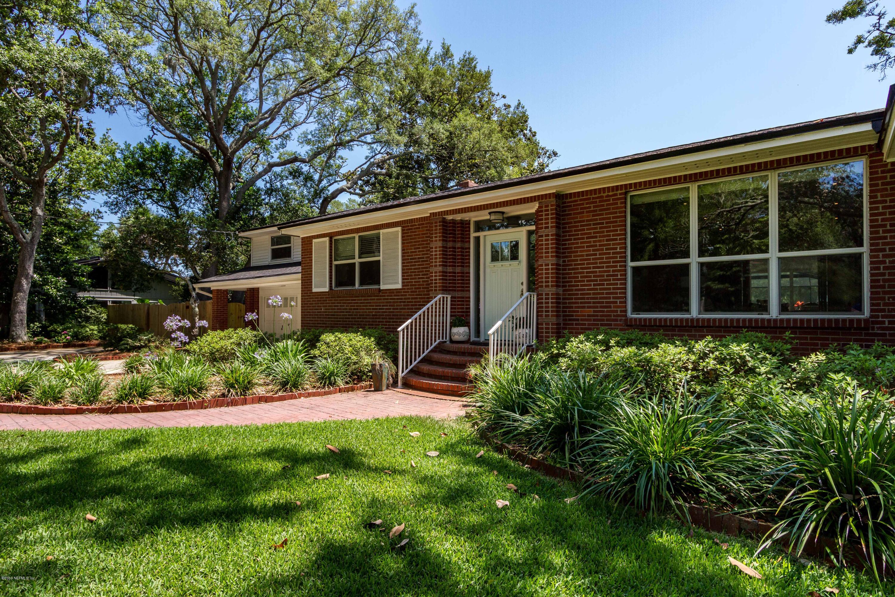 841 Penman Road Neptune Beach, FL 32266 - Photo 38 of 92 a front view of a house with a yard and potted plants