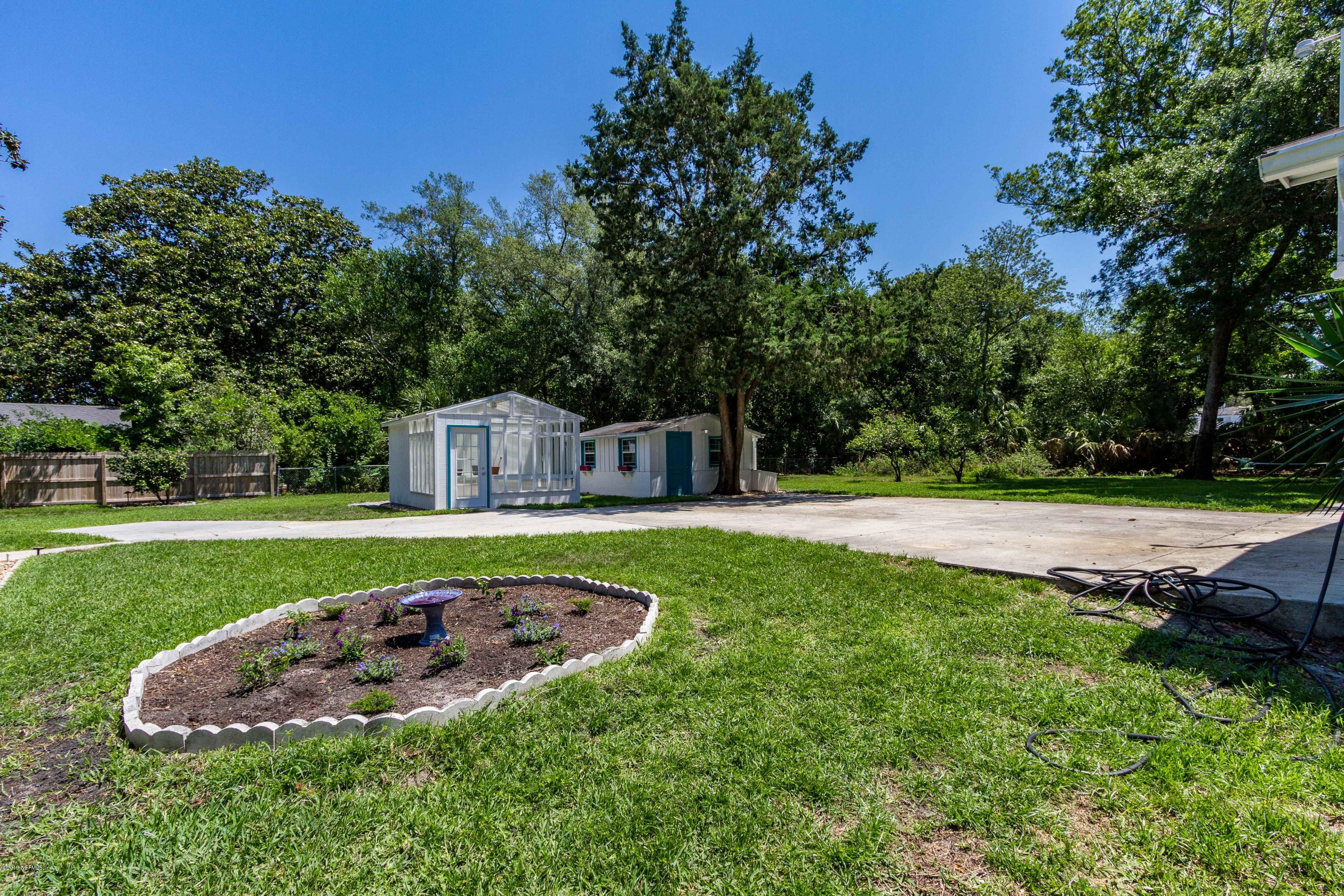 841 Penman Road Neptune Beach, FL 32266 - Photo 54 of 92 a view of a garden with a fountain