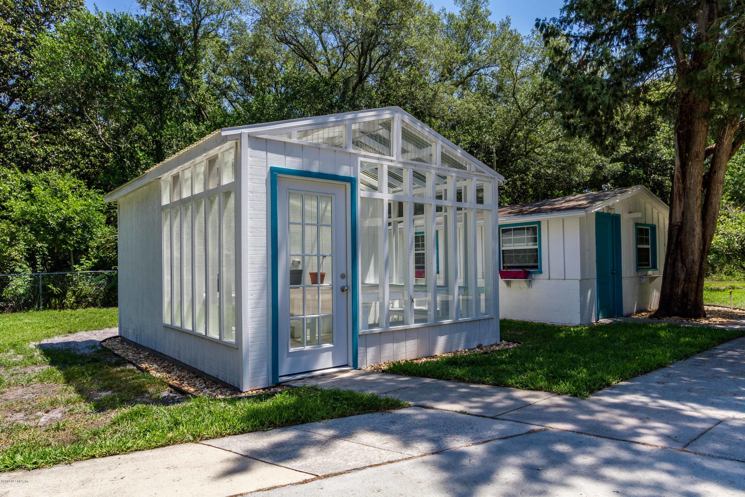 841 Penman Road Neptune Beach, FL 32266 - Photo 61 of 92 a front view of a house with a garden