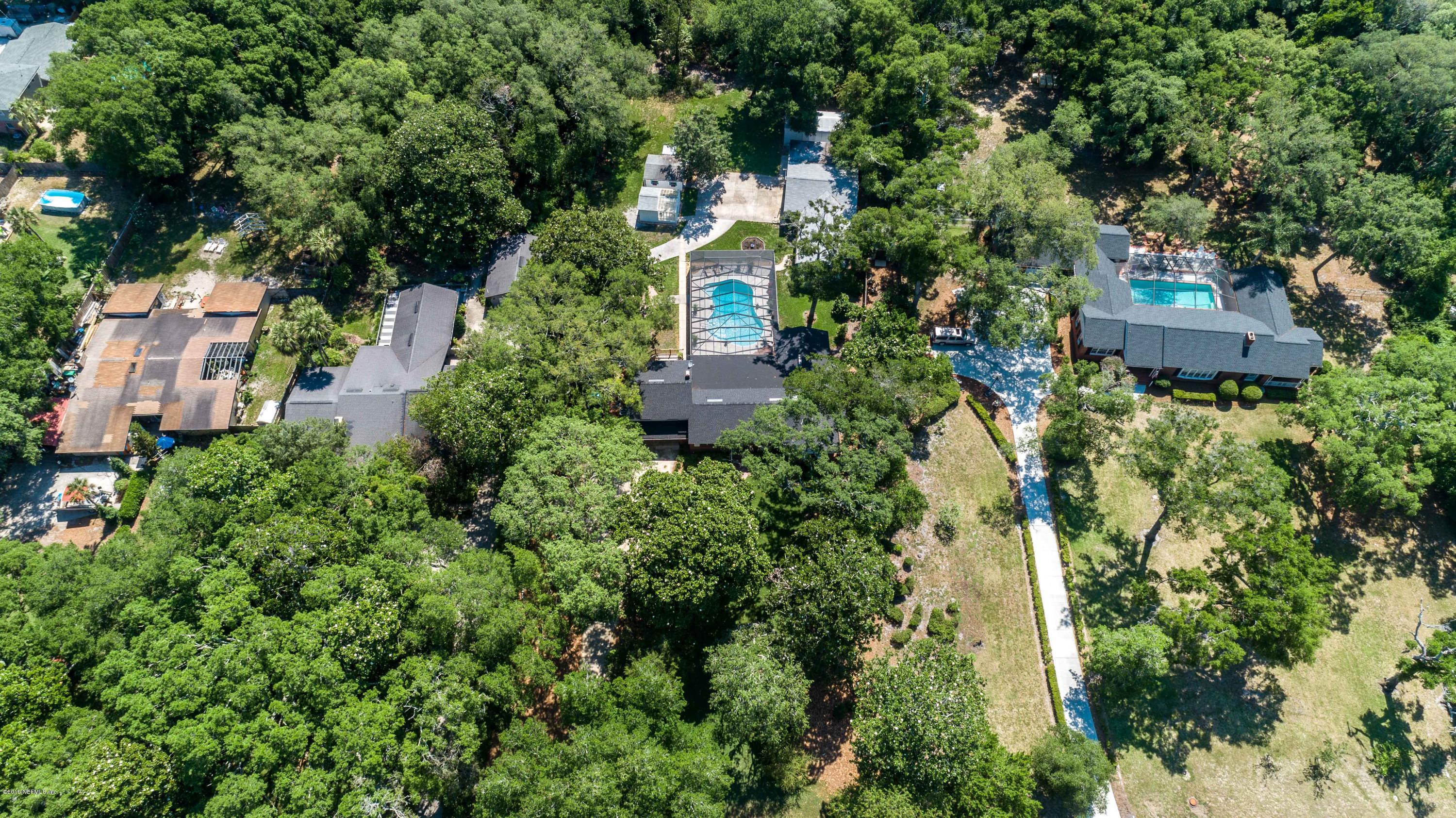 841 Penman Road Neptune Beach, FL 32266 - Photo 79 of 92 an aerial view of a house with a yard and large trees