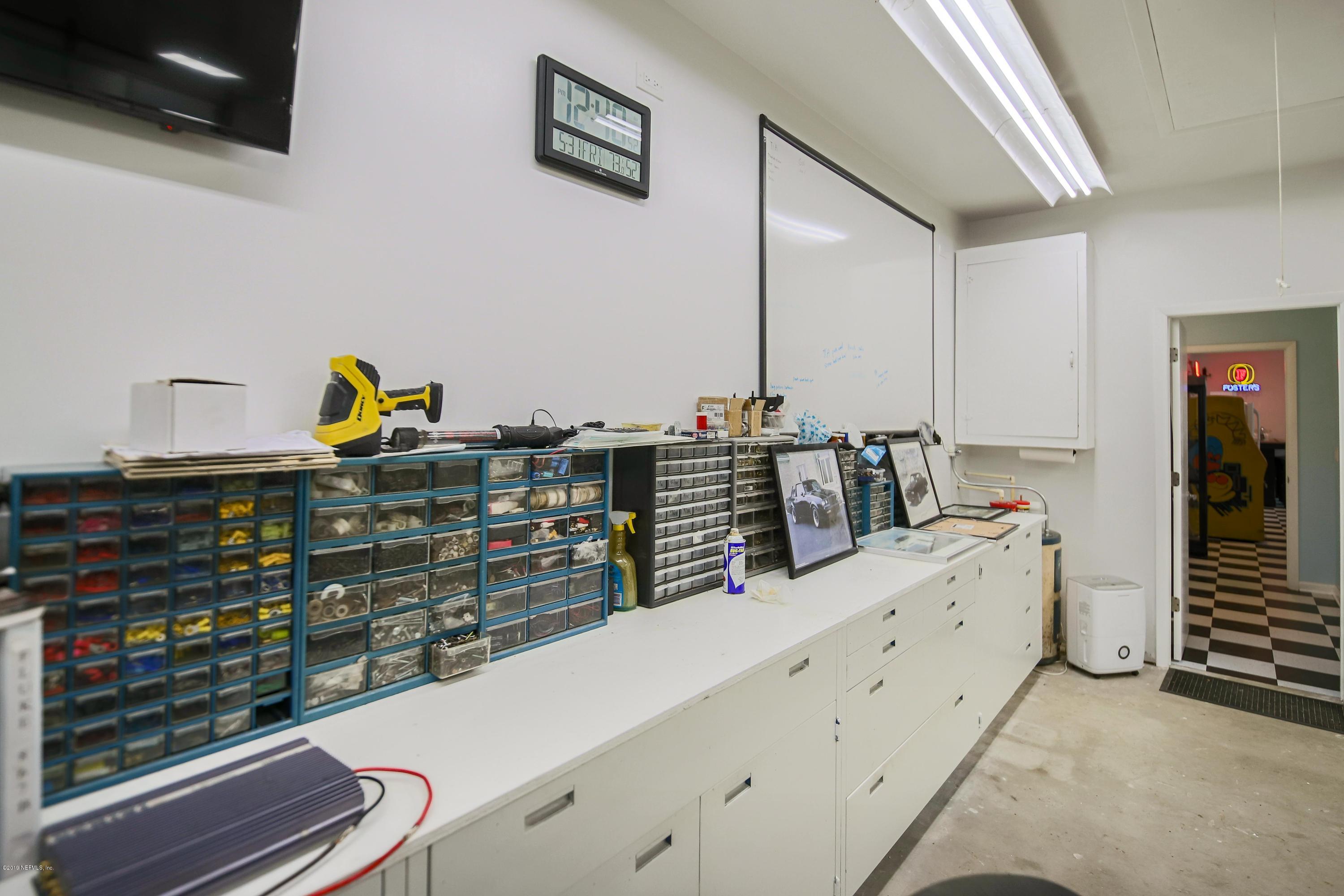 841 Penman Road Neptune Beach, FL 32266 - Photo 92 of 92 a kitchen with stainless steel appliances kitchen island granite countertop a lot of cabinets