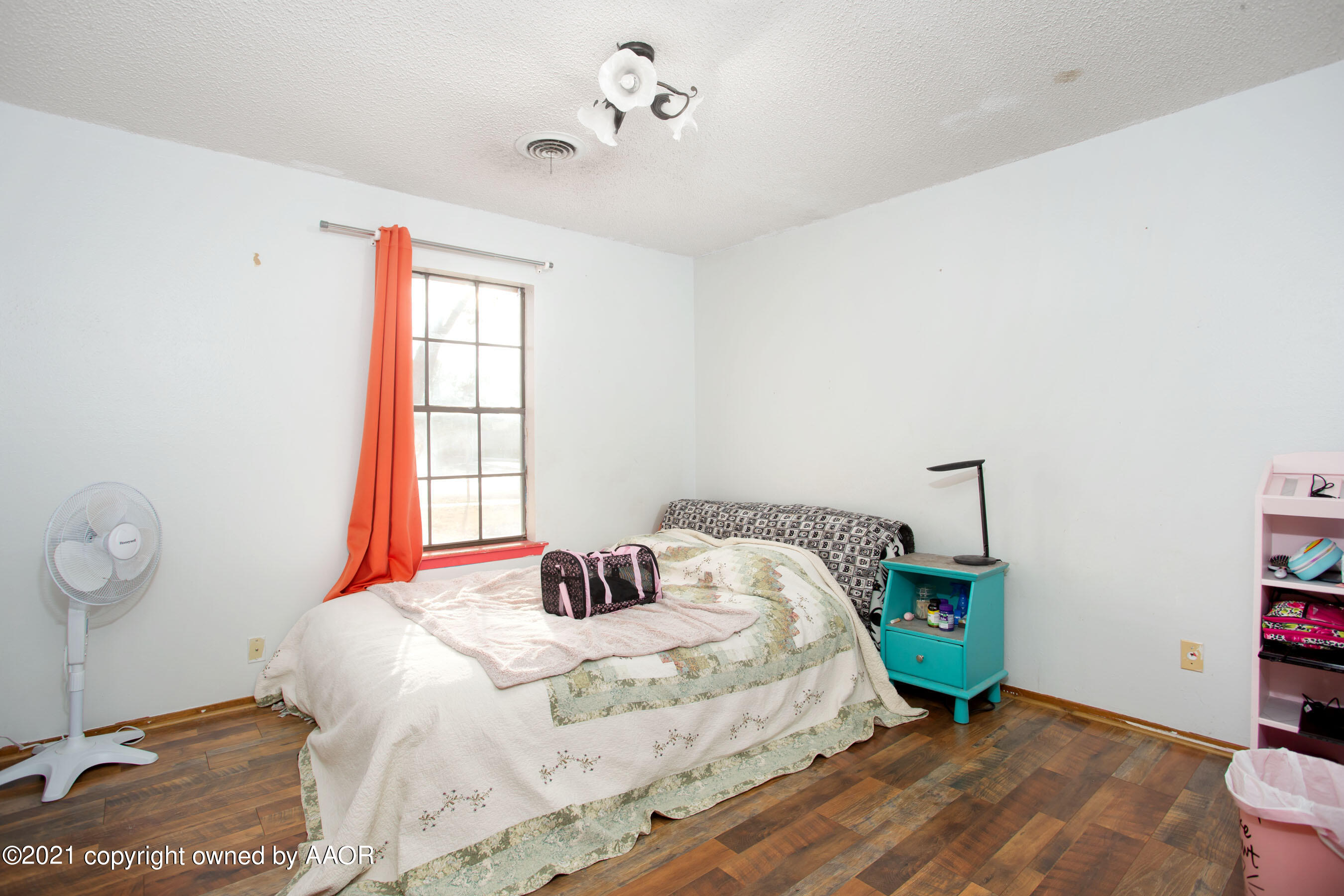 5306 South Fannin Street Amarillo, TX 79110 - Photo 14 of 18 a bedroom with a bed and a window