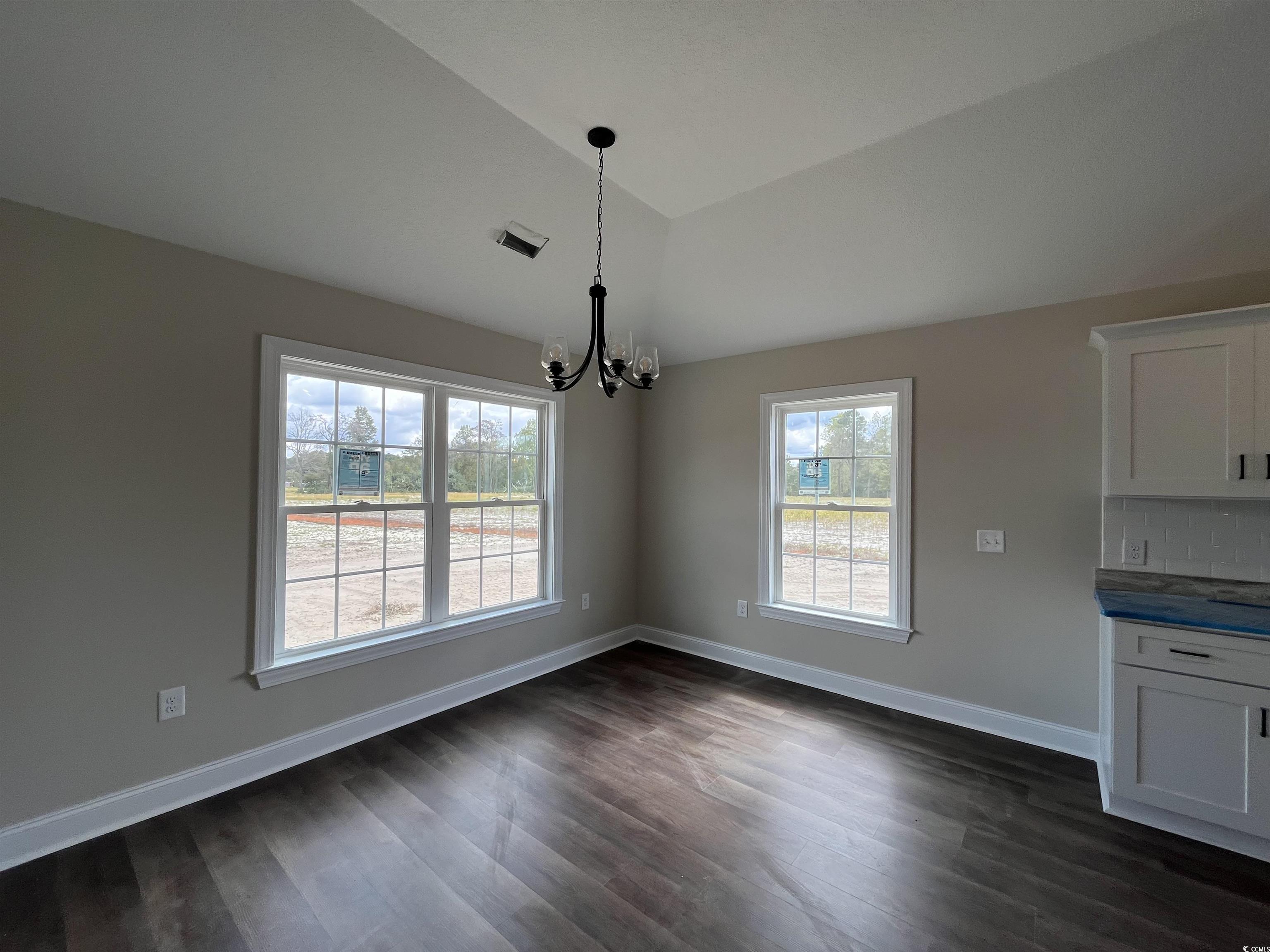 499 Highway 348 Loris, SC 29569 - Photo 11 of 27 Unfurnished dining area featuring lofted ceiling,