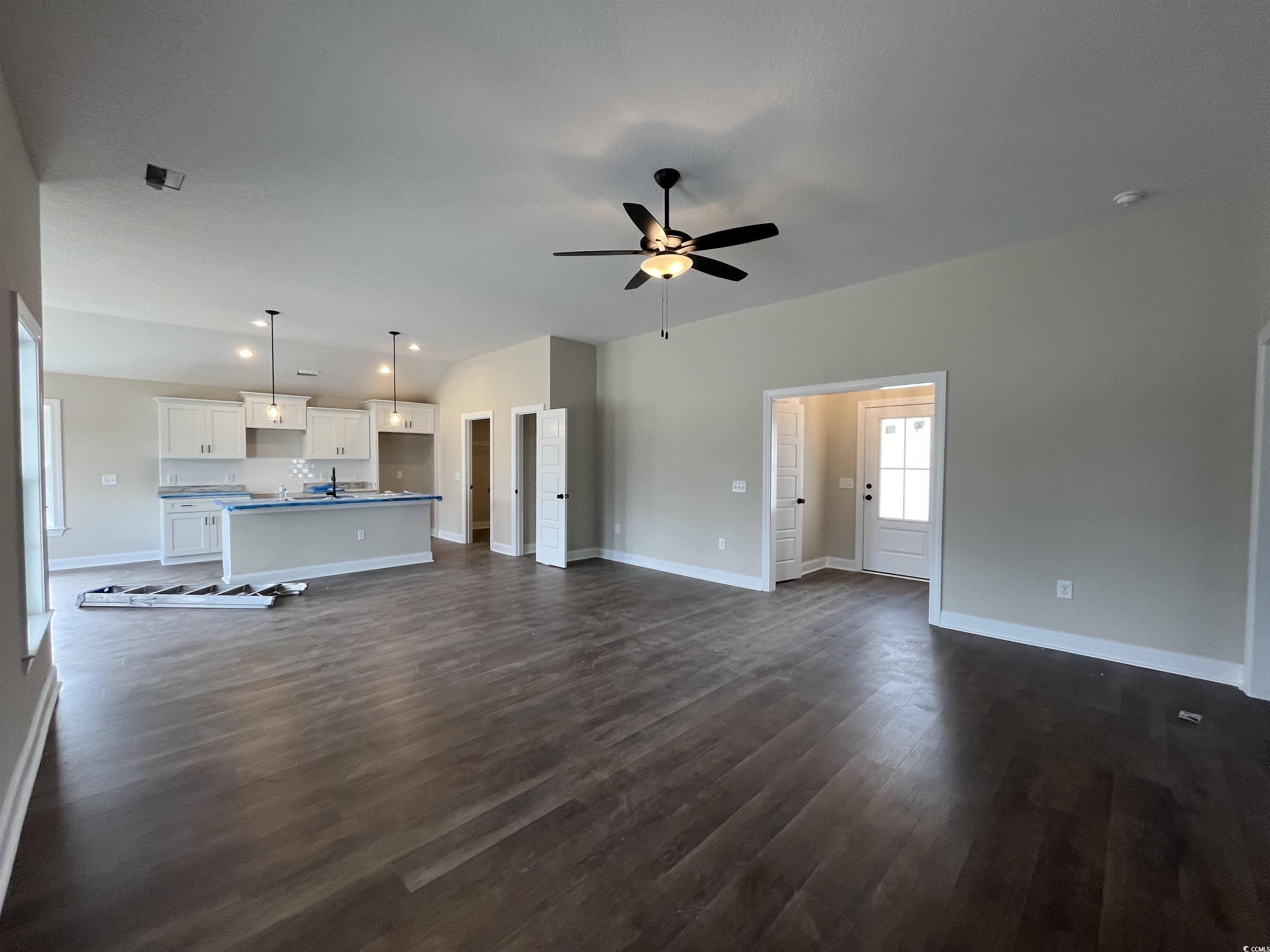 499 Highway 348 Loris, SC 29569 - Photo 5 of 27 Unfurnished living room featuring dark hardwood /