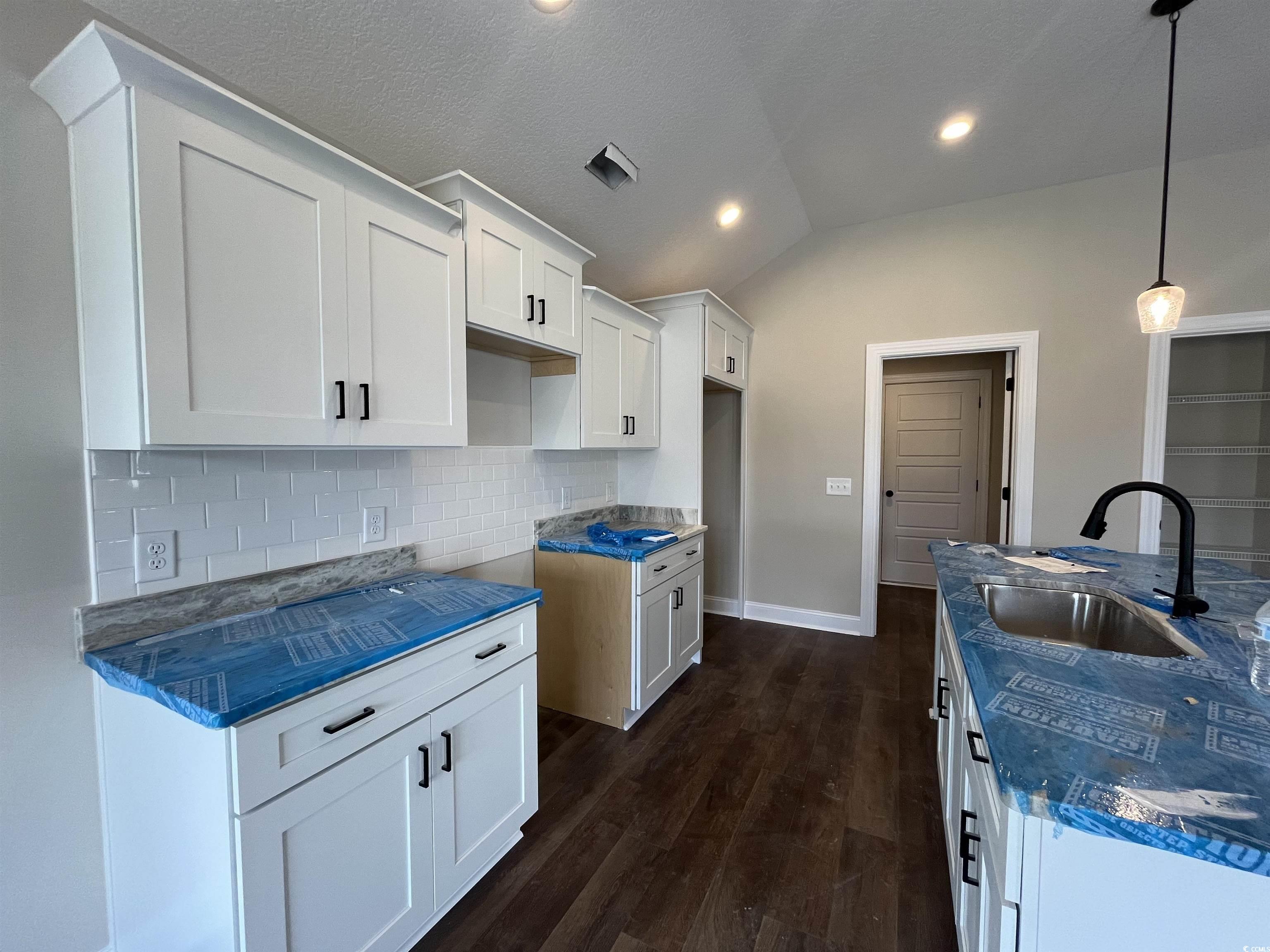 499 Highway 348 Loris, SC 29569 - Photo 6 of 27 Kitchen featuring lofted ceiling, dark wood-type f