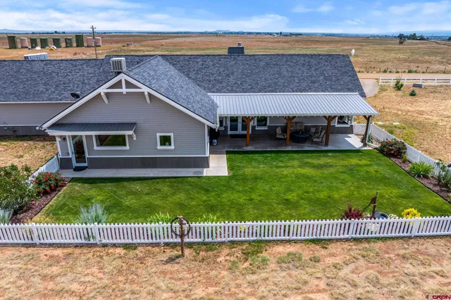 swimming pool view with a garden