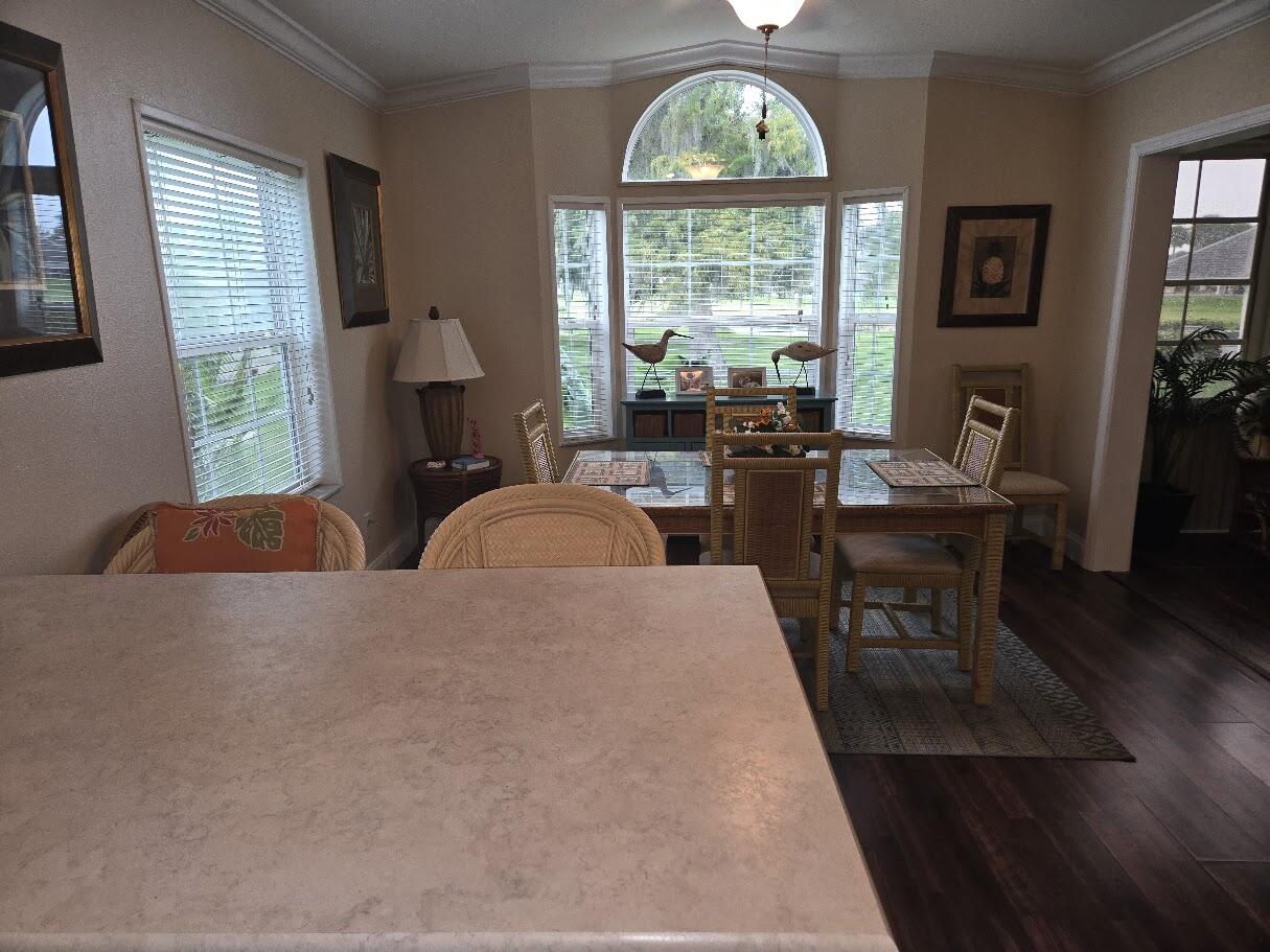 13680 Northwest 127th Terrace, Unit 17 Okeechobee, FL 34974 - Photo 13 of 30 a living room with furniture and a large window