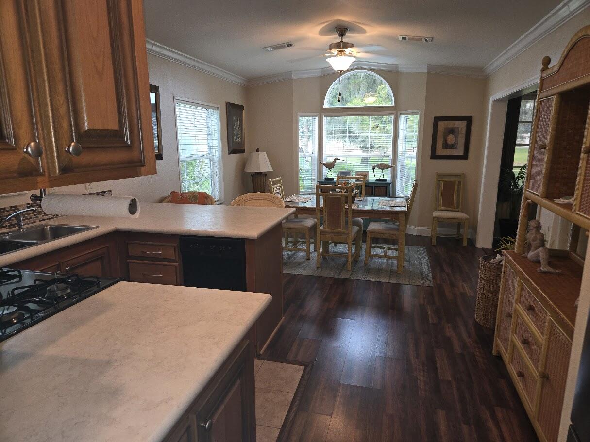 13680 Northwest 127th Terrace, Unit 17 Okeechobee, FL 34974 - Photo 14 of 30 a view of a livingroom with furniture window and wooden floor