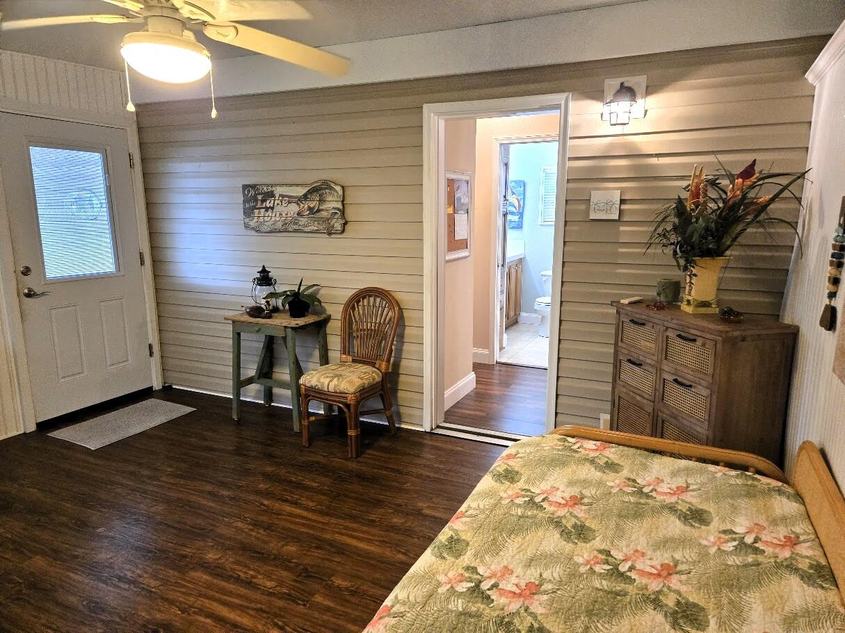 13680 Northwest 127th Terrace, Unit 17 Okeechobee, FL 34974 - Photo 20 of 30 a living room with furniture and a rug