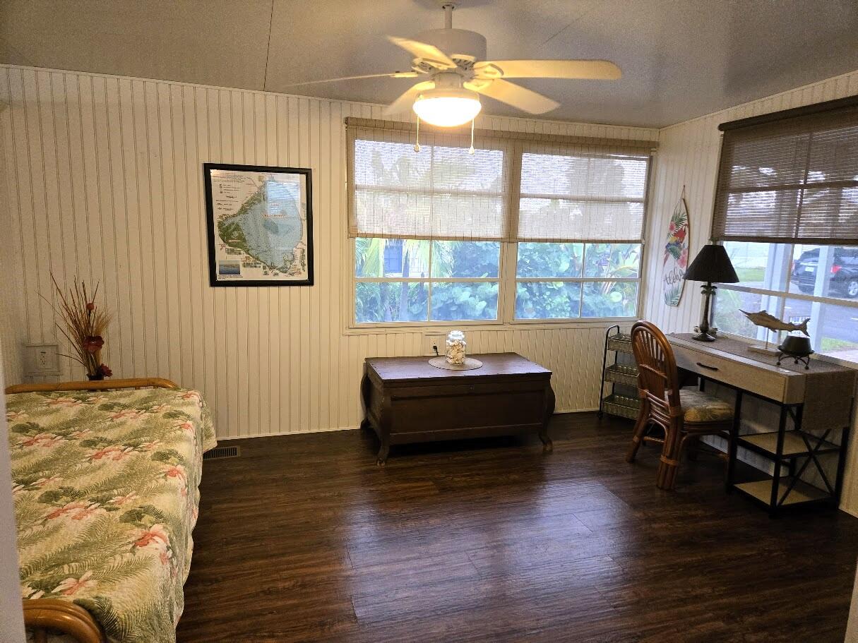 13680 Northwest 127th Terrace, Unit 17 Okeechobee, FL 34974 - Photo 21 of 30 a living room with furniture and a wooden floor