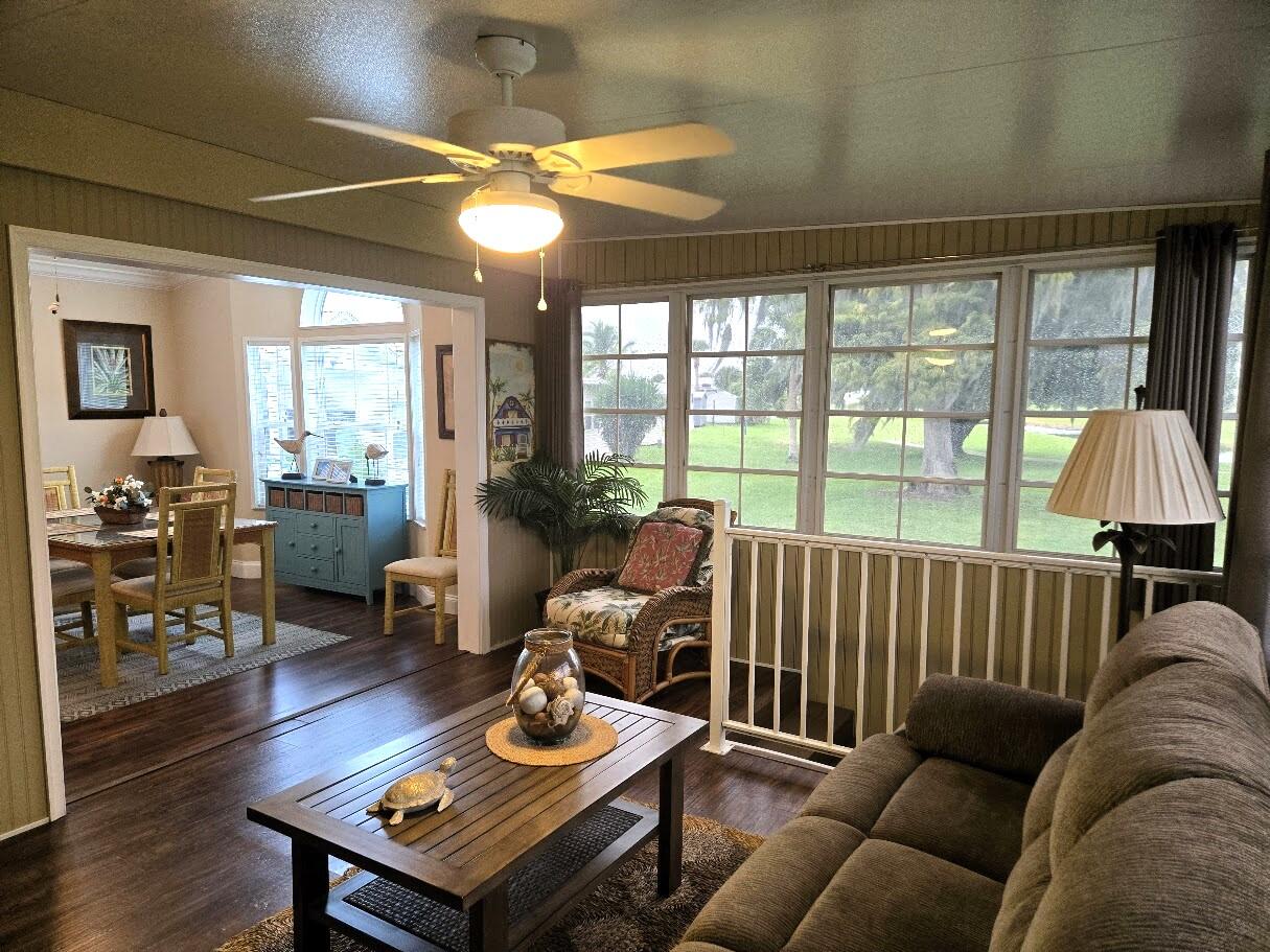 13680 Northwest 127th Terrace, Unit 17 Okeechobee, FL 34974 - Photo 5 of 30 a living room with furniture and a large window
