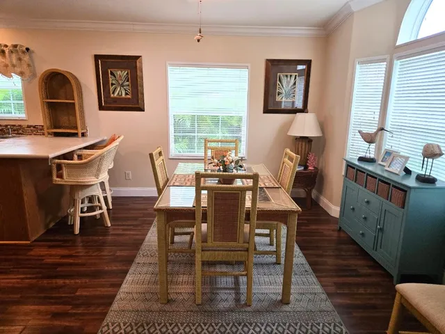 a kitchen with stainless steel appliances granite countertop a sink and a refrigerator