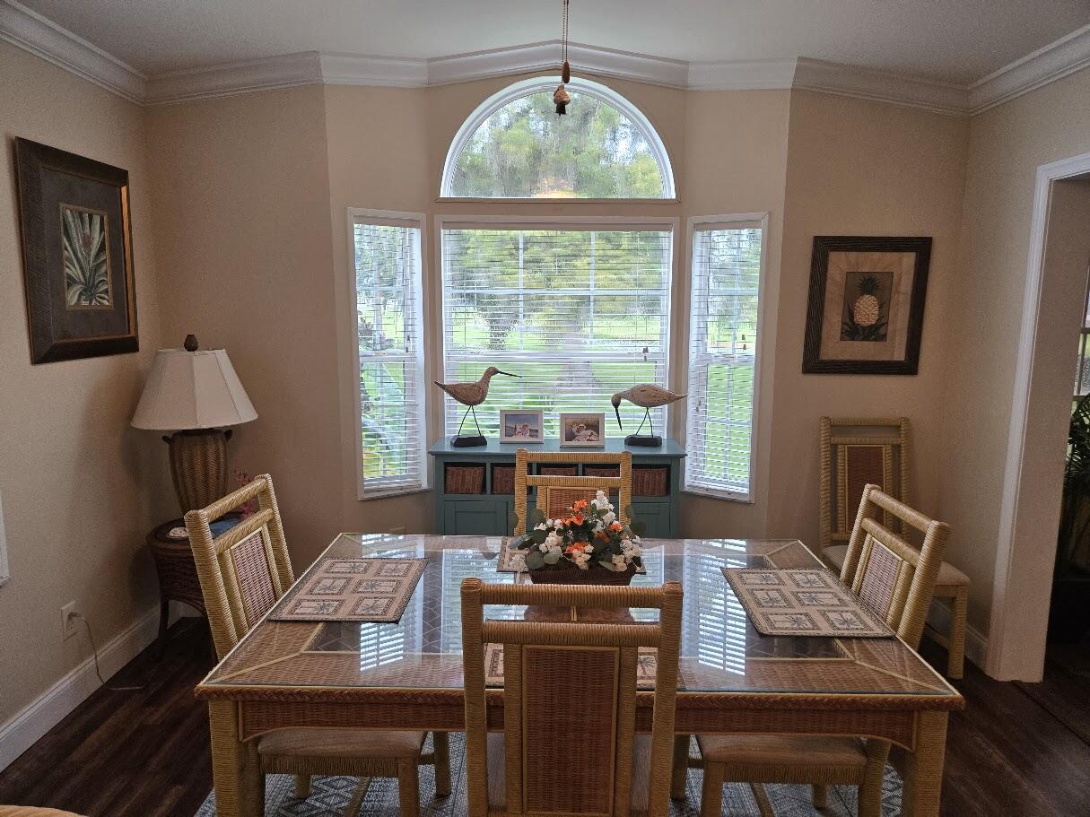 13680 Northwest 127th Terrace, Unit 17 Okeechobee, FL 34974 - Photo 7 of 30 a view of a dining room with furniture window and outside view