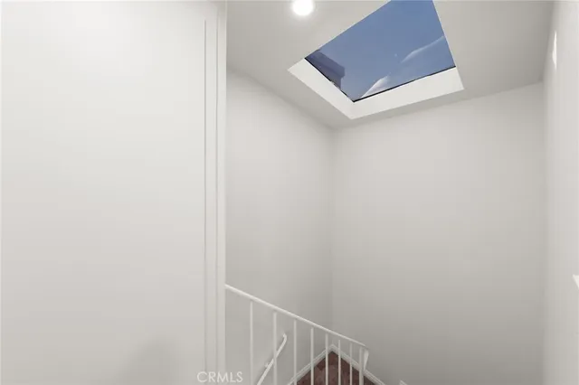 a kitchen with white cabinets and a sink