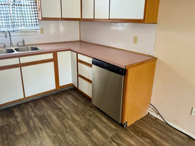 a kitchen with a sink and a window
