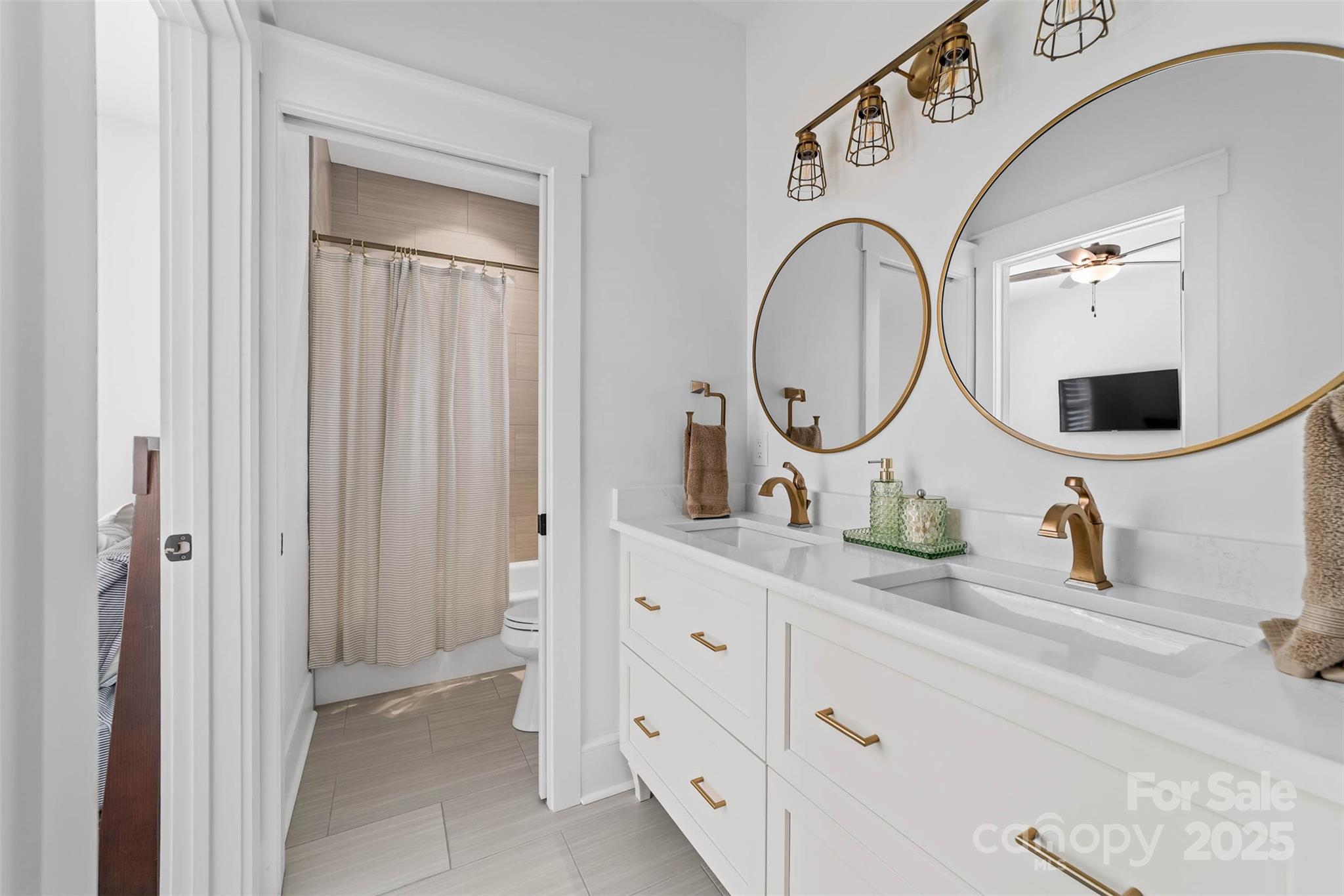 4554 Ina Lane Sherrills Ford, NC 28673 - Photo 18 of 44 a bathroom with a double vanity sink and a mirror