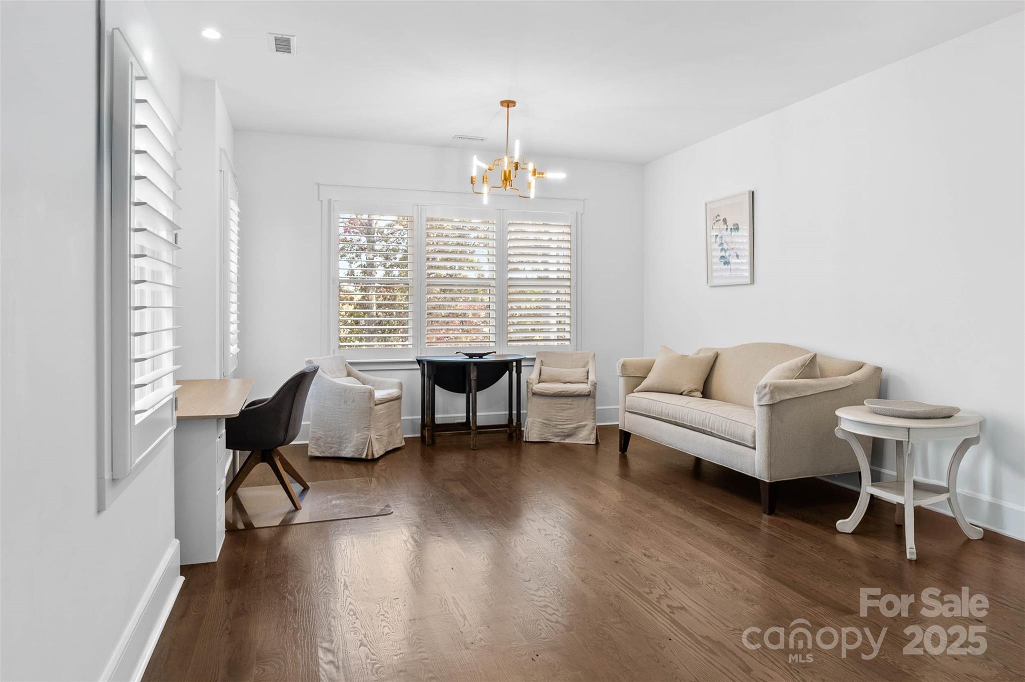 4554 Ina Lane Sherrills Ford, NC 28673 - Photo 21 of 44 a living room with furniture or wooden floor and a chandelier