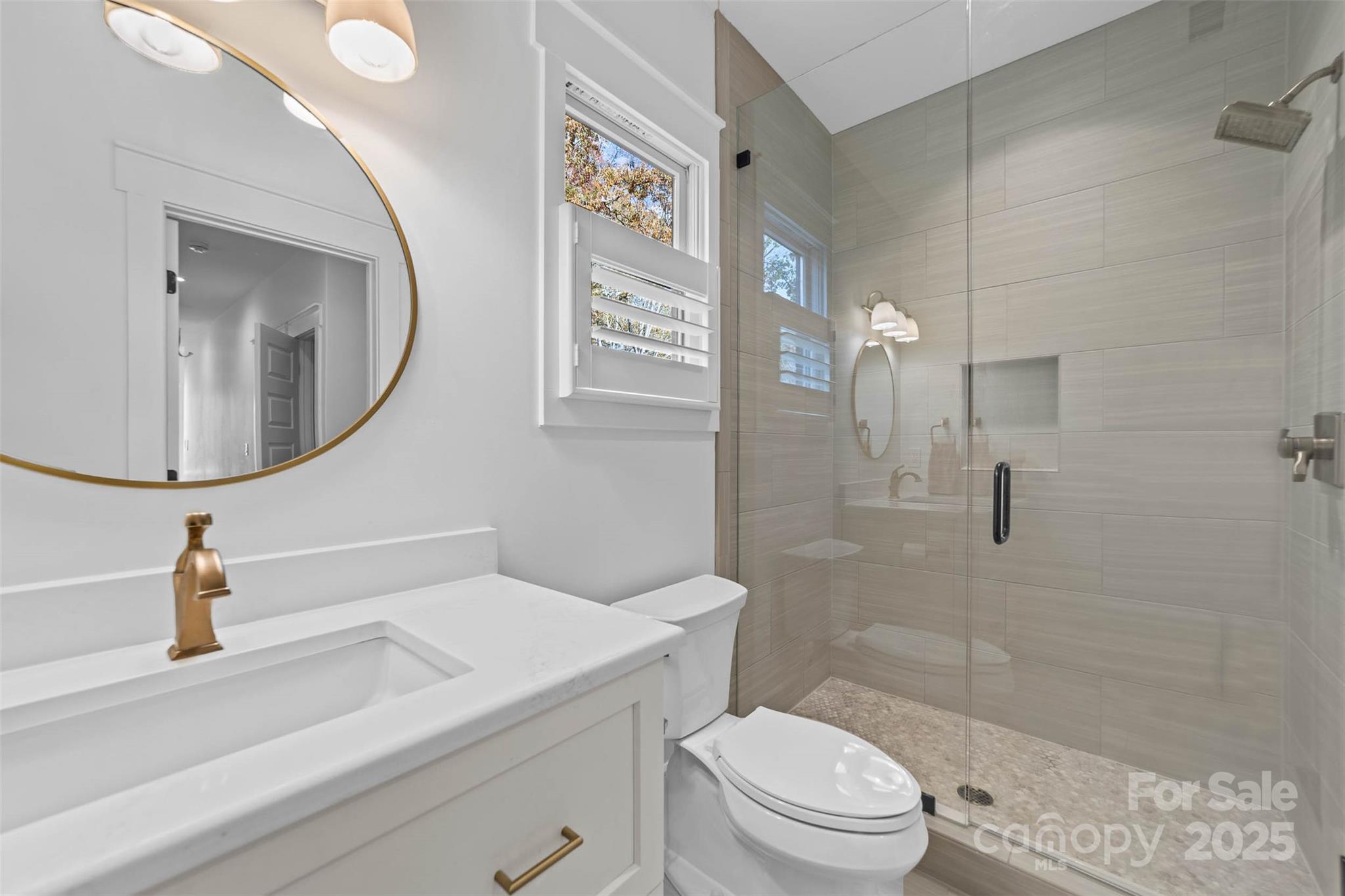 4554 Ina Lane Sherrills Ford, NC 28673 - Photo 23 of 44 a bathroom with a sink a toilet and shower