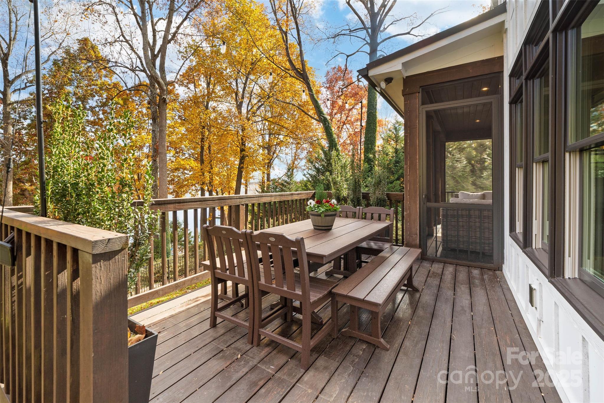 4554 Ina Lane Sherrills Ford, NC 28673 - Photo 29 of 44 a view of a patio with table and chairs with wooden floor and fence