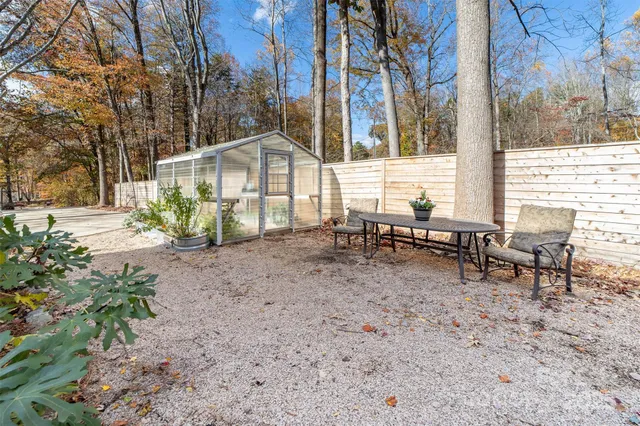 a backyard of a house with lots of green space