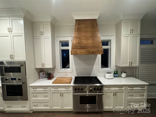 a kitchen with a stove and a sink