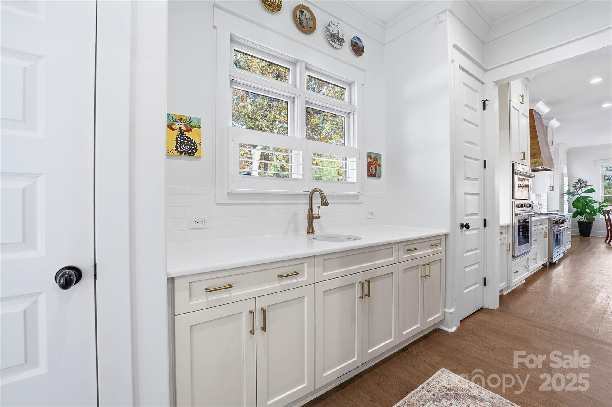 4554 Ina Lane Sherrills Ford, NC 28673 - Photo 5 of 44 a spacious bathroom with a double vanity sink a mirror a shower and bathtub
