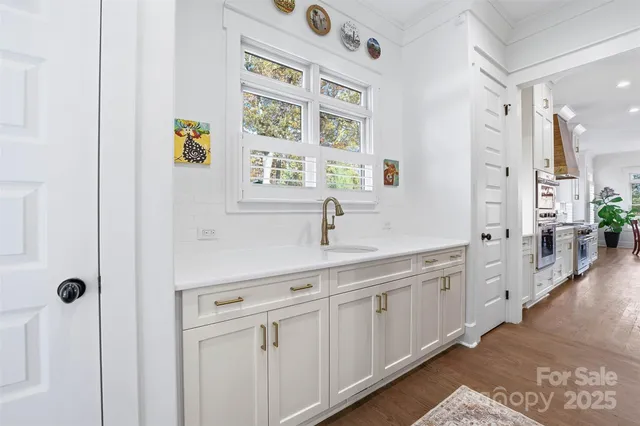 a spacious bathroom with a double vanity sink a mirror a shower and bathtub