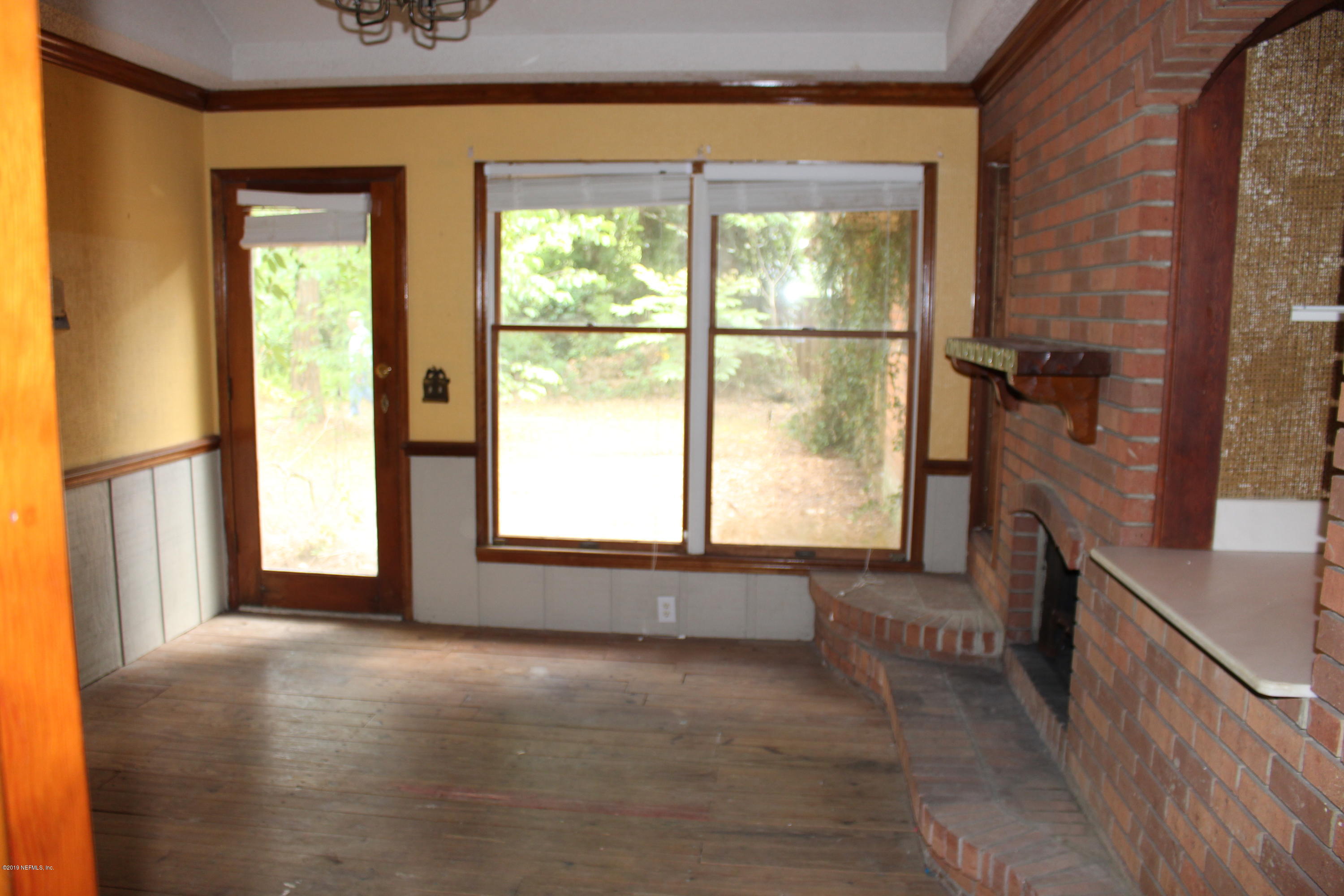 9656 Wexford Road Jacksonville, FL 32257 - Photo 7 of 18 a view of an empty room with a window