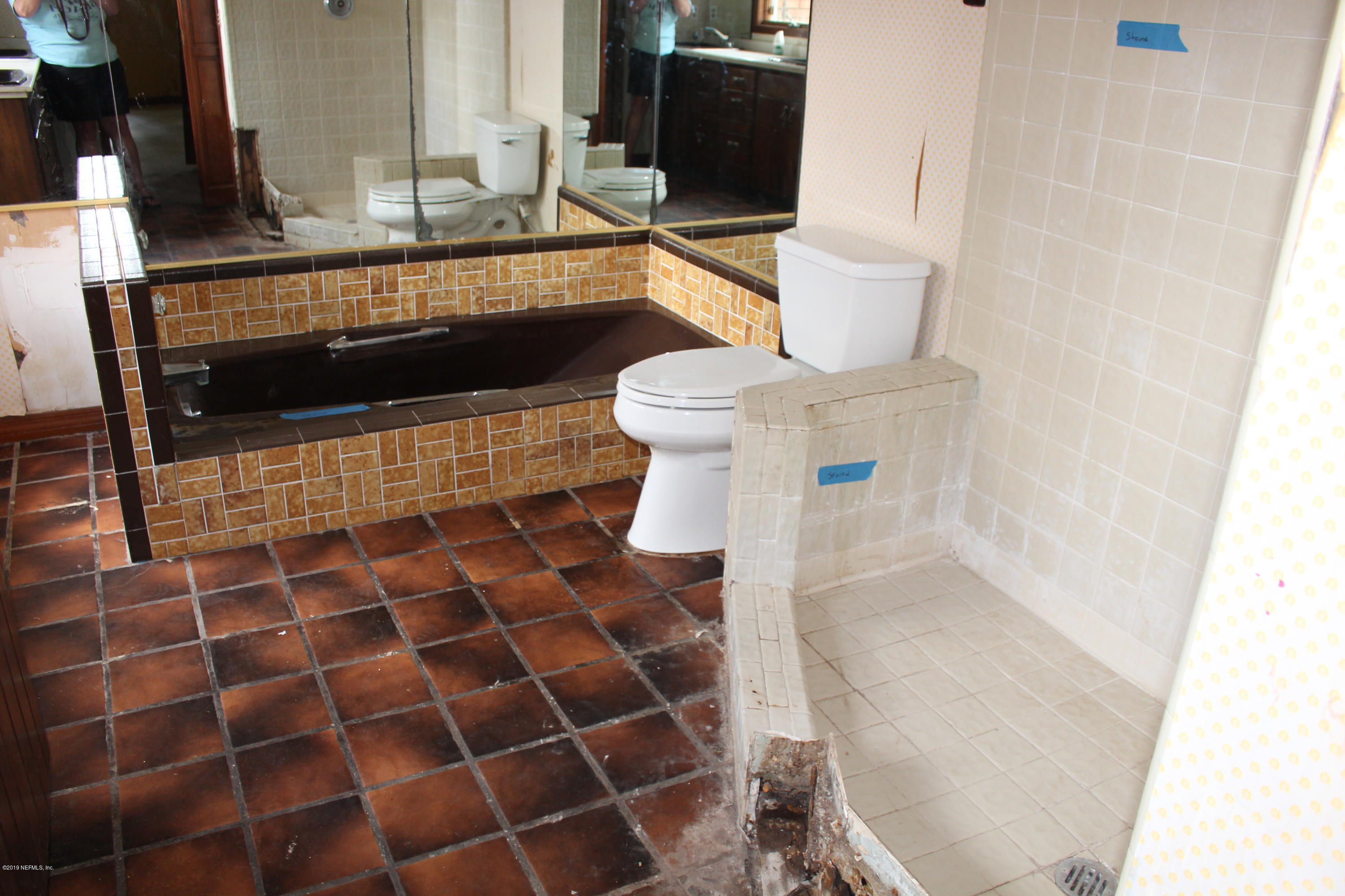 9656 Wexford Road Jacksonville, FL 32257 - Photo 10 of 18 a bathroom with a sink and a mirror